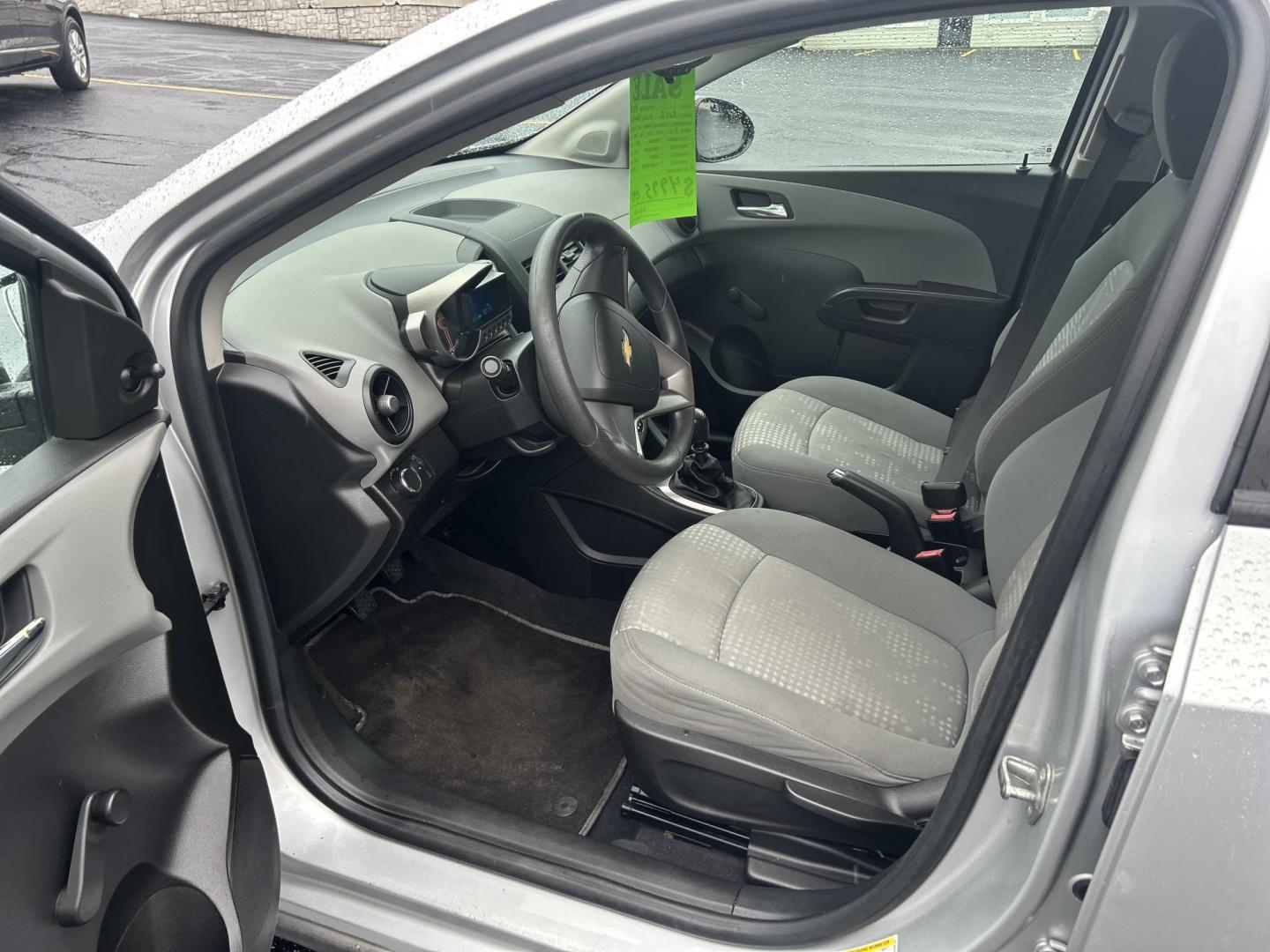 2012 Silver /Gray Chevrolet Sonic 1LS 5-Door (1G1JB6SH4C4) with an 1.8L L4 DOHC 24V FFV engine, 5-Speed Manual transmission, located at 27 Main St., Norway, MD, 04268, (207) 743-0900, 44.199795, -70.530807 - Photo#6
