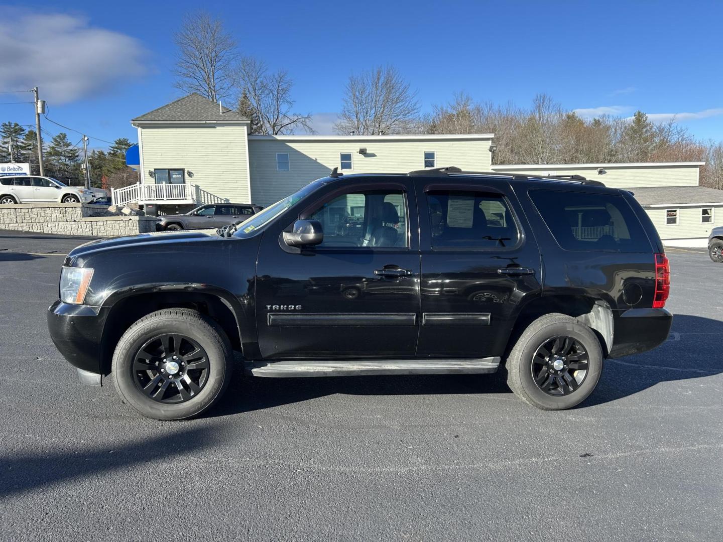 2013 Black /Black Chevrolet Tahoe LT 4WD (1GNSKBE04DR) with an 5.3L V8 OHV 16V FFV engine, 6-Speed Automatic transmission, located at 27 Main St., Norway, MD, 04268, (207) 743-0900, 44.199795, -70.530807 - Photo#1
